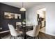 Dining room featuring a glass table, four chairs, and sliding glass doors to the patio at 3840 Knollton Rd # A, Indianapolis, IN 46228