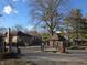 Gated community entrance featuring brick pillar, signage and mature trees at 3840 Knollton Rd # A, Indianapolis, IN 46228