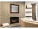 Living room with a gray brick fireplace and mantel, offering a cozy and inviting atmosphere at 3840 Knollton Rd # A, Indianapolis, IN 46228