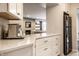 Bright kitchen with modern espresso maker and granite counters, open to the living room at 3840 Knollton Rd # A, Indianapolis, IN 46228