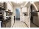 Well lit kitchen featuring stainless steel appliances, white cabinets, and modern hardware at 3840 Knollton Rd # A, Indianapolis, IN 46228