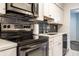 Beautiful kitchen with stainless steel appliances, white cabinets, and black subway tile at 3840 Knollton Rd # A, Indianapolis, IN 46228