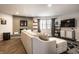 Bright living room featuring a gray brick fireplace, comfortable sofa, and modern decor at 3840 Knollton Rd # A, Indianapolis, IN 46228