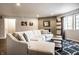 Inviting living room with comfortable seating, gray brick fireplace, and modern decor at 3840 Knollton Rd # A, Indianapolis, IN 46228