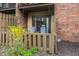 Second floor patio featuring sliding glass doors, privacy fence and two chairs at 3840 Knollton Rd # A, Indianapolis, IN 46228