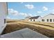 Backyard with a view of other homes in the new construction neighborhood at 4825 Topaz Pointe Blvd, Lawrence, IN 46235
