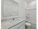 Clean, bright bathroom with white fixtures and a large mirror at 4825 Topaz Pointe Blvd, Lawrence, IN 46235