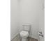 This powder room features a toilet and wood-look flooring at 4825 Topaz Pointe Blvd, Lawrence, IN 46235