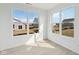 Bright bedroom with three large windows offering views of the neighborhood at 4825 Topaz Pointe Blvd, Lawrence, IN 46235