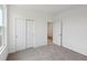 Bright bedroom features neutral carpet, white walls, a closet, and natural light at 4825 Topaz Pointe Blvd, Lawrence, IN 46235