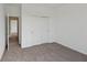 Neutral bedroom featuring carpet and closet with sliding doors at 4825 Topaz Pointe Blvd, Lawrence, IN 46235