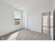 Bedroom featuring carpet, closet with sliding doors and natural light at 4825 Topaz Pointe Blvd, Lawrence, IN 46235