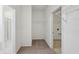 Carpeted walk-in closet with wire shelving, laundry room with tile floors, and bathroom visible at 4825 Topaz Pointe Blvd, Lawrence, IN 46235