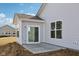 Exterior view of the home showing siding, windows, and patio at 4825 Topaz Pointe Blvd, Lawrence, IN 46235