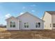 View of the home's side exterior, highlighting the siding and window placement at 4825 Topaz Pointe Blvd, Lawrence, IN 46235