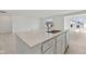 Modern kitchen featuring white cabinetry, stainless appliances, and a spacious center island at 4825 Topaz Pointe Blvd, Lawrence, IN 46235