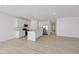 Bright open-concept home showcasing a modern kitchen, stainless appliances, and hardwood floors at 4825 Topaz Pointe Blvd, Lawrence, IN 46235