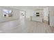 Bright open-concept home showcasing a modern kitchen, stainless appliances, and hardwood floors at 4825 Topaz Pointe Blvd, Lawrence, IN 46235