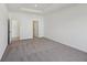 This carpeted bedroom includes a tray ceiling and white walls at 4825 Topaz Pointe Blvd, Lawrence, IN 46235