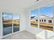 Bright sunroom with sliding glass door and large windows offering views of the backyard at 4825 Topaz Pointe Blvd, Lawrence, IN 46235