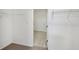 A walk-in closet with carpeted flooring has built-in wire shelving for storage at 4825 Topaz Pointe Blvd, Lawrence, IN 46235