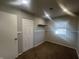 Inviting bedroom boasts a neutral color scheme, soft carpet, closet, and a bright window, perfect for relaxation at 504 Iroquois Dr, Anderson, IN 46012