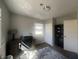 Bedroom with a desk, office chair, and shelves at 504 Iroquois Dr, Anderson, IN 46012