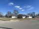 View of house from across the intersection, with street sign in front yard at 504 Iroquois Dr, Anderson, IN 46012