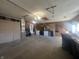 Spacious garage with ample storage, washer, dryer, and overhead lighting, ideal for hobbies and projects at 504 Iroquois Dr, Anderson, IN 46012