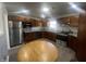 A well-lit kitchen with stainless steel appliances and granite countertops at 504 Iroquois Dr, Anderson, IN 46012