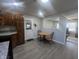 A kitchen leading to a dining area with light gray floors at 504 Iroquois Dr, Anderson, IN 46012