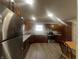 This kitchen has stainless steel appliances, granite counters, and dark wood cabinets at 504 Iroquois Dr, Anderson, IN 46012
