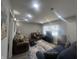 Bright living room featuring large windows, recessed lighting, and comfortable seating area at 504 Iroquois Dr, Anderson, IN 46012