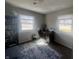 Cozy office space with natural light and a wall of bookcases at 504 Iroquois Dr, Anderson, IN 46012