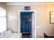 View into laundry room with 'Personal Cave' door and laundry machine at 510 E Campbell St, Edinburgh, IN 46124