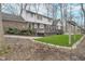 The backyard features a deck, green space, and mature trees at 5214 Woodfield Dr, Carmel, IN 46033