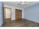 Bedroom featuring a ceiling fan, closet, and hardwood floors, offering a cozy space at 5214 Woodfield Dr, Carmel, IN 46033