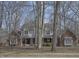 Charming home with brick and siding exterior, mature trees at 5214 Woodfield Dr, Carmel, IN 46033