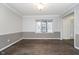 A living room with hardwood floors and chair rail accents, perfect for entertaining and relaxation at 5214 Woodfield Dr, Carmel, IN 46033