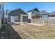 Backyard with garage, concrete patio, bare ground, and wood fence at 569 N Tacoma Ave, Indianapolis, IN 46201