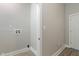 Hallway with a utility box, neutral walls, white trim, and wood-look flooring at 569 N Tacoma Ave, Indianapolis, IN 46201
