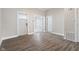 Bright, open-concept living room with modern flooring and neutral paint at 569 N Tacoma Ave, Indianapolis, IN 46201