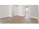 Bright, open-concept living room with modern flooring and neutral paint at 569 N Tacoma Ave, Indianapolis, IN 46201