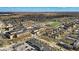 Aerial view of a neighborhood featuring a school, houses, and nearby retail at 5935 Compton St, Indianapolis, IN 46220