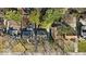 Aerial view of multiple single Gathering homes with mature trees, landscaping, and a mix of yard sizes at 5935 Compton St, Indianapolis, IN 46220