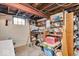 Unfinished basement with workbench and storage for tools and supplies at 5935 Compton St, Indianapolis, IN 46220