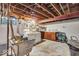Unfinished basement with laundry area and sink offers potential for customization and additional storage at 5935 Compton St, Indianapolis, IN 46220