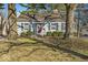Charming single-story home with a well-maintained lawn and mature trees, creating a welcoming curb appeal at 5935 Compton St, Indianapolis, IN 46220