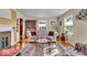 Cozy living room with hardwood floors, fireplace, and natural light, offering a warm and inviting atmosphere at 5935 Compton St, Indianapolis, IN 46220