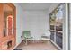 This charming screened-in porch has comfortable seating and views of the surrounding yard at 5935 Compton St, Indianapolis, IN 46220